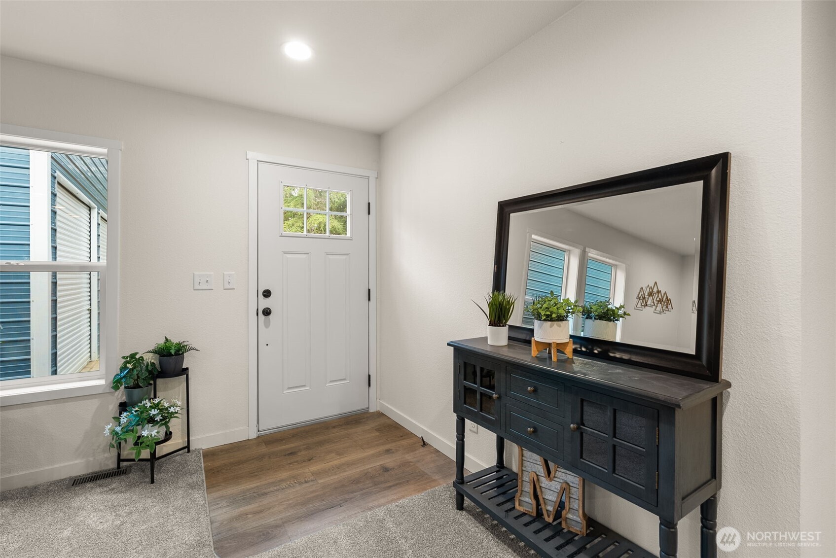 1110 Koontz Road Chehalis, WA 98532 - Photo 5 of 33 a view of a hallway with a potted plant on a table and a potted plant