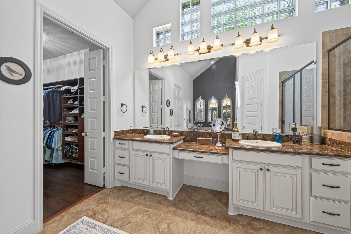 19852 Cullen Ridge Drive Porter, TX 77365 - Photo 20 of 43 Primary Bathroom features high ceilings, dual sinks with granite countertops,make up area, and HUGE walk in closet! Abundant natural light through upper windows!