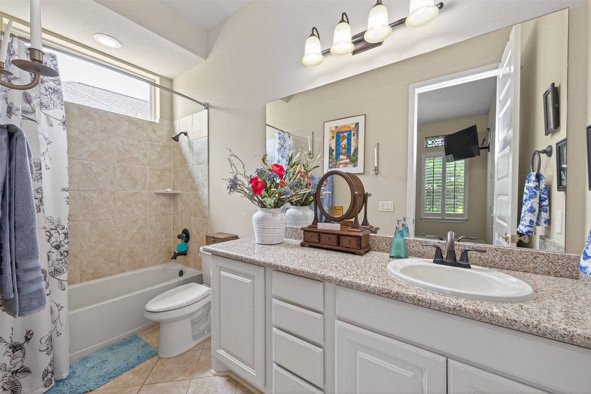19852 Cullen Ridge Drive Porter, TX 77365 - Photo 23 of 43 Bedroom #2 Ensuite Bathroom, Granite counters and tile flooring.