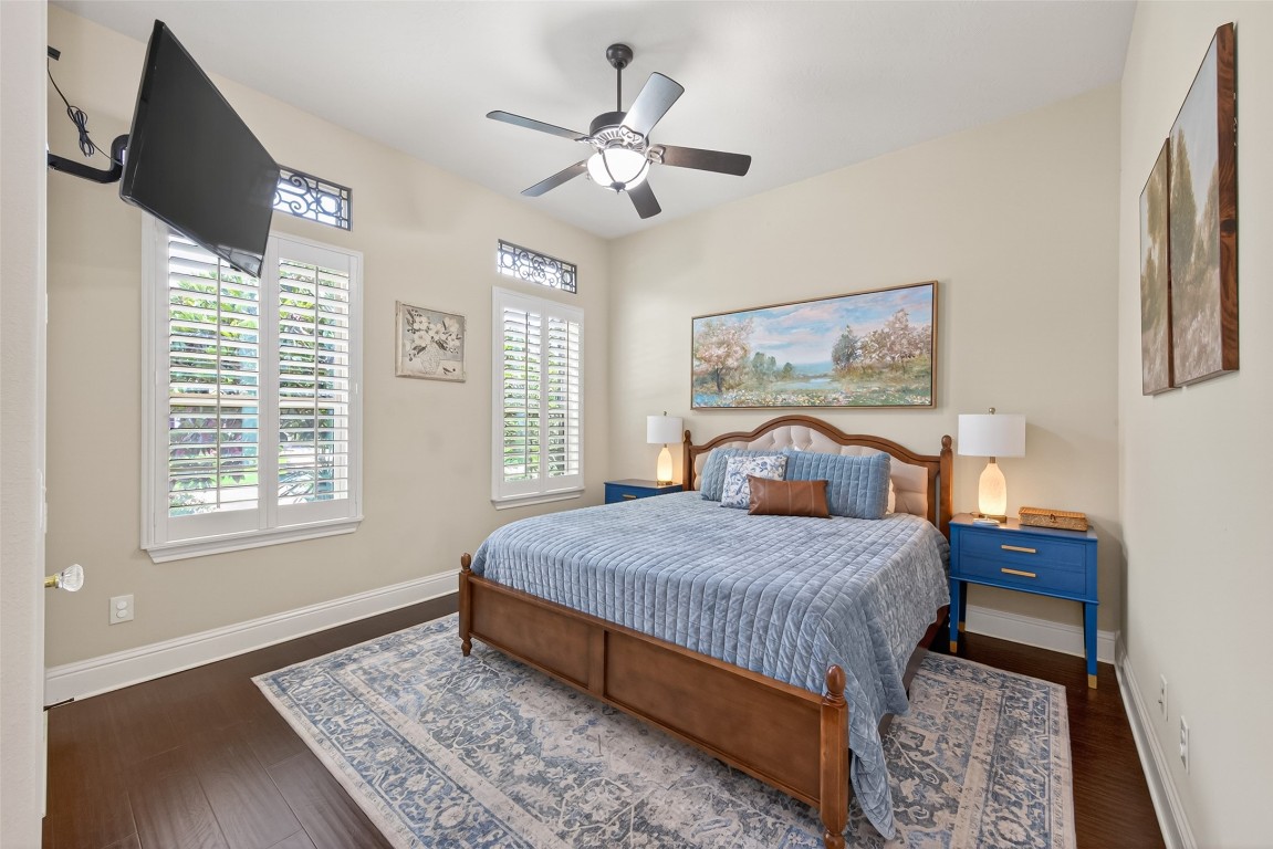 19852 Cullen Ridge Drive Porter, TX 77365 - Photo 24 of 43 Bedroom #2 Large room with its own ensuite bath and walk in closet! Beautiful Window Shutters!