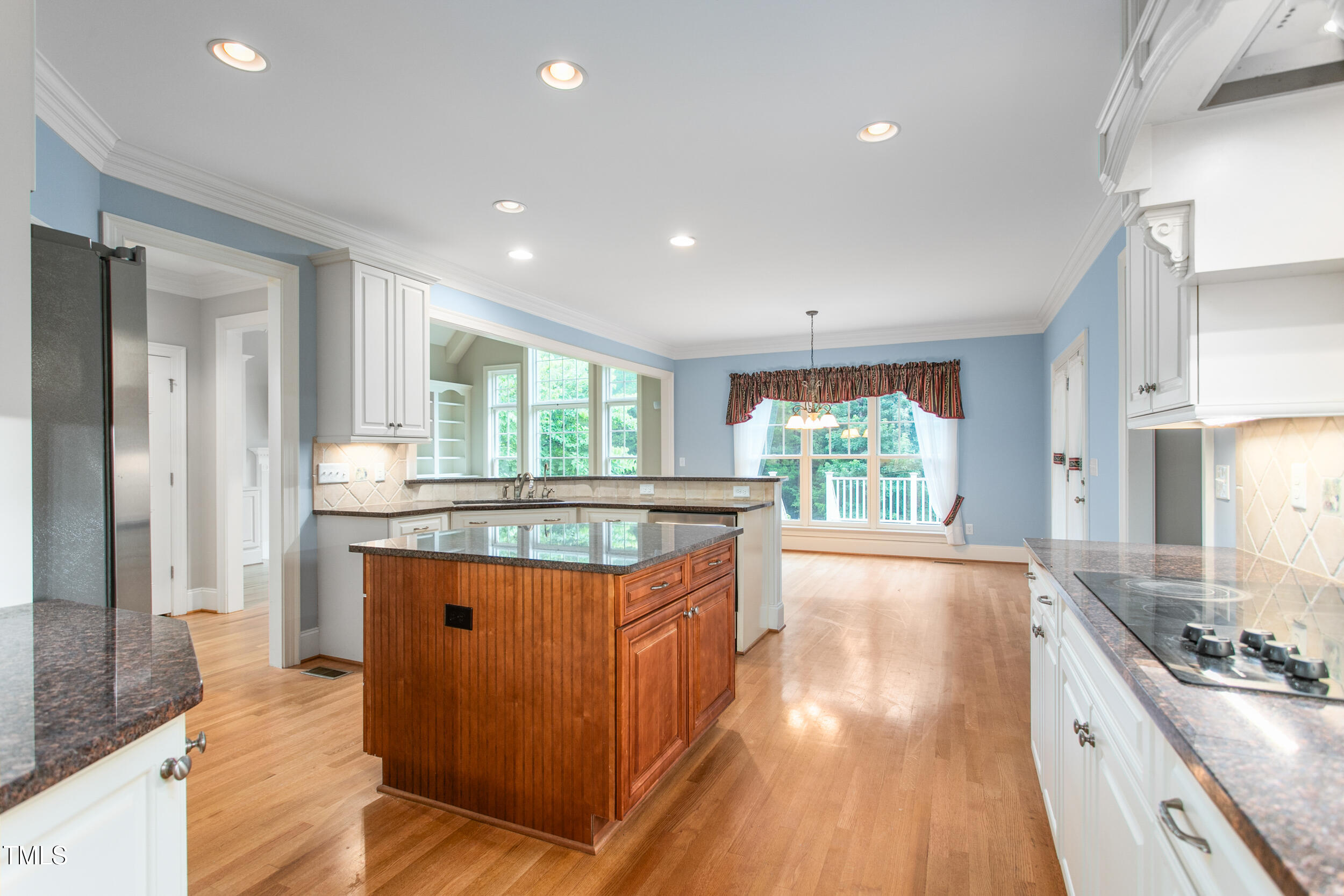 6366 Lineberry Road Liberty, NC 27298 - Photo 13 of 44 a kitchen with kitchen island granite countertop a stove and a sink