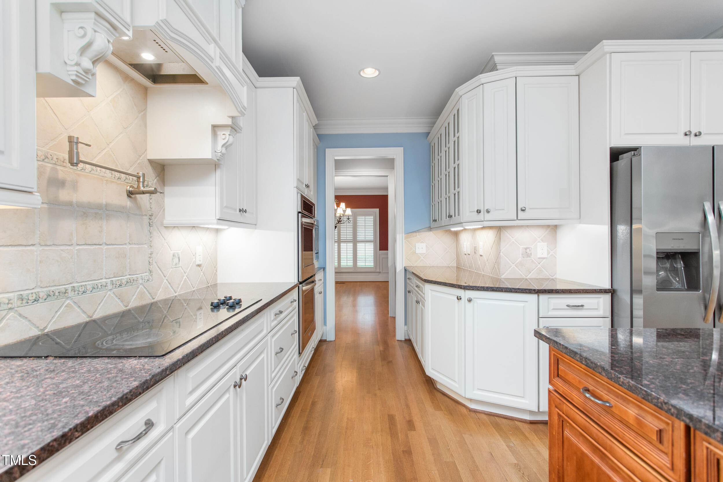 6366 Lineberry Road Liberty, NC 27298 - Photo 14 of 44 a kitchen with granite countertop a sink stove and refrigerator