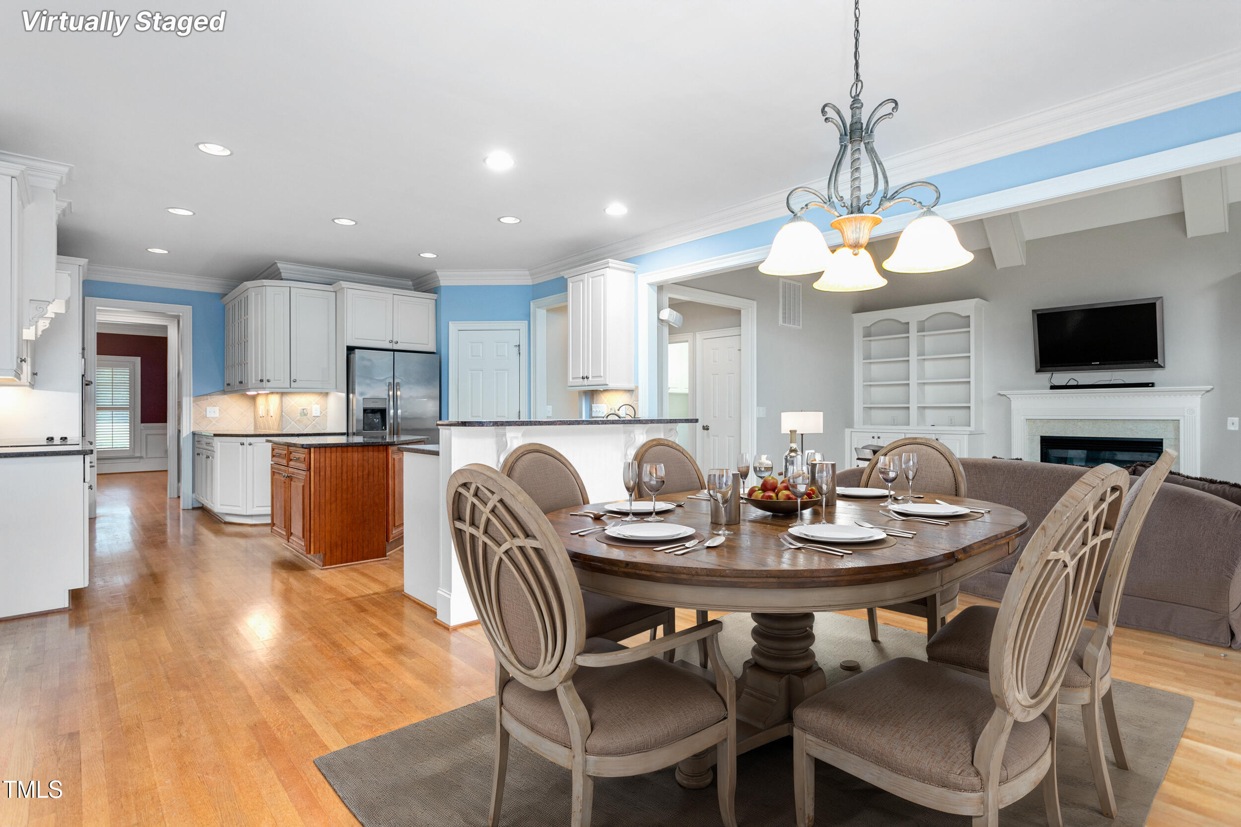 6366 Lineberry Road Liberty, NC 27298 - Photo 15 of 44 a view of a dining room with furniture a chandelier and wooden floor