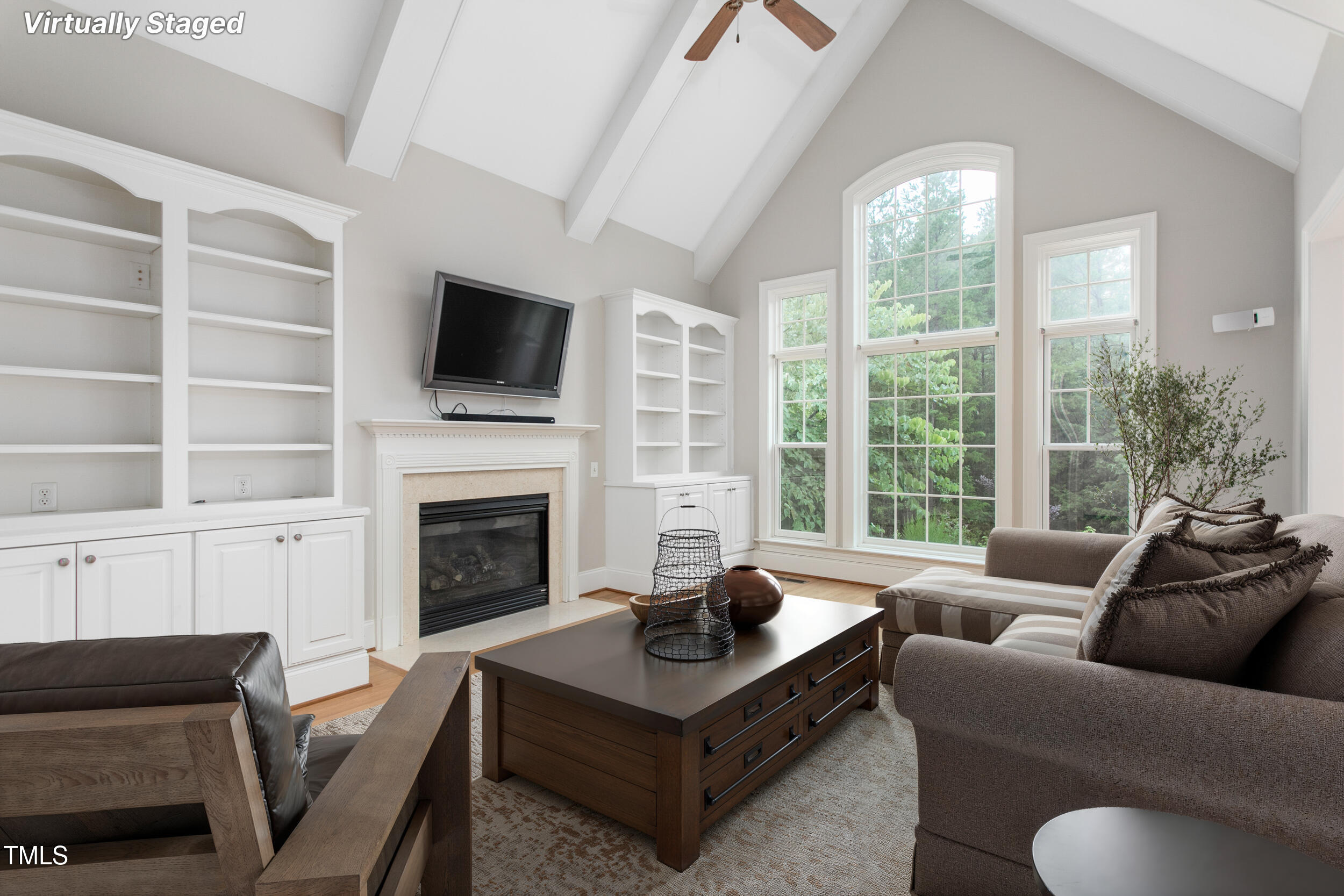 6366 Lineberry Road Liberty, NC 27298 - Photo 19 of 44 a living room with furniture a flat screen tv and a fireplace