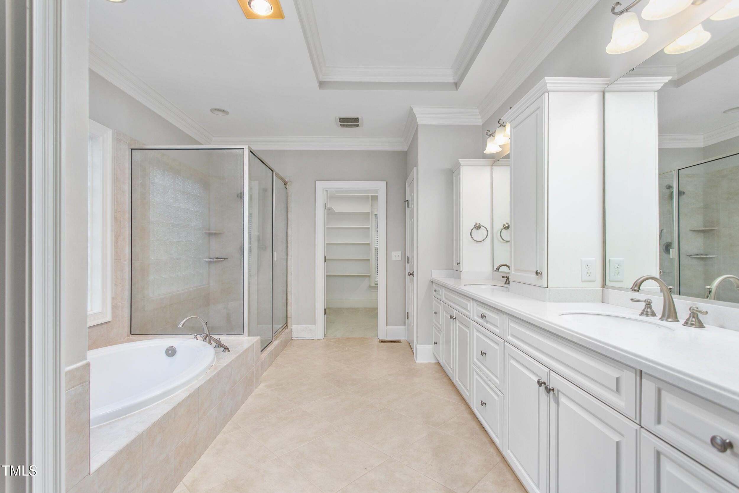 6366 Lineberry Road Liberty, NC 27298 - Photo 23 of 44 a spacious bathroom with a double vanity sink and a bathtub