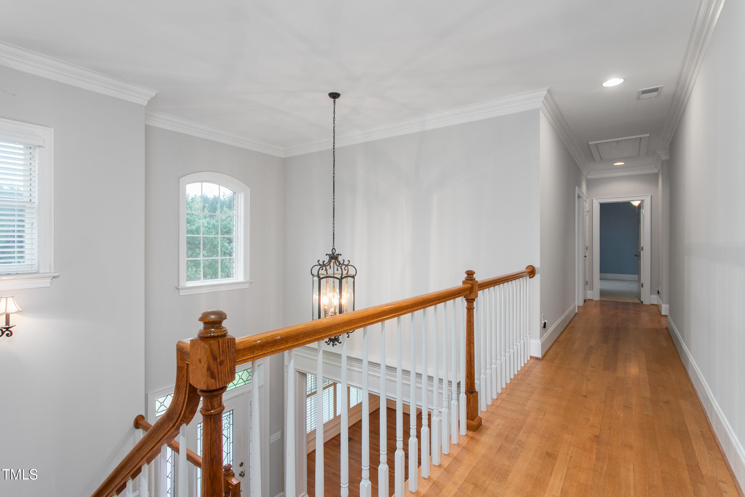 6366 Lineberry Road Liberty, NC 27298 - Photo 26 of 44 a view of a hallway with wooden floor and stairs