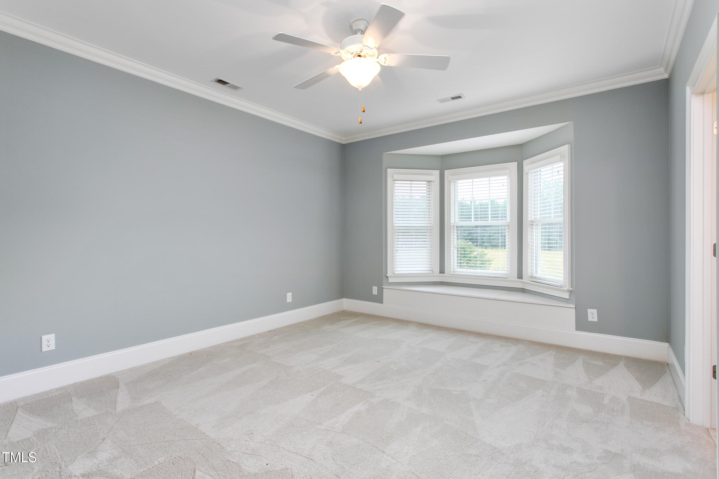6366 Lineberry Road Liberty, NC 27298 - Photo 27 of 44 an empty room with a window and a ceiling fan