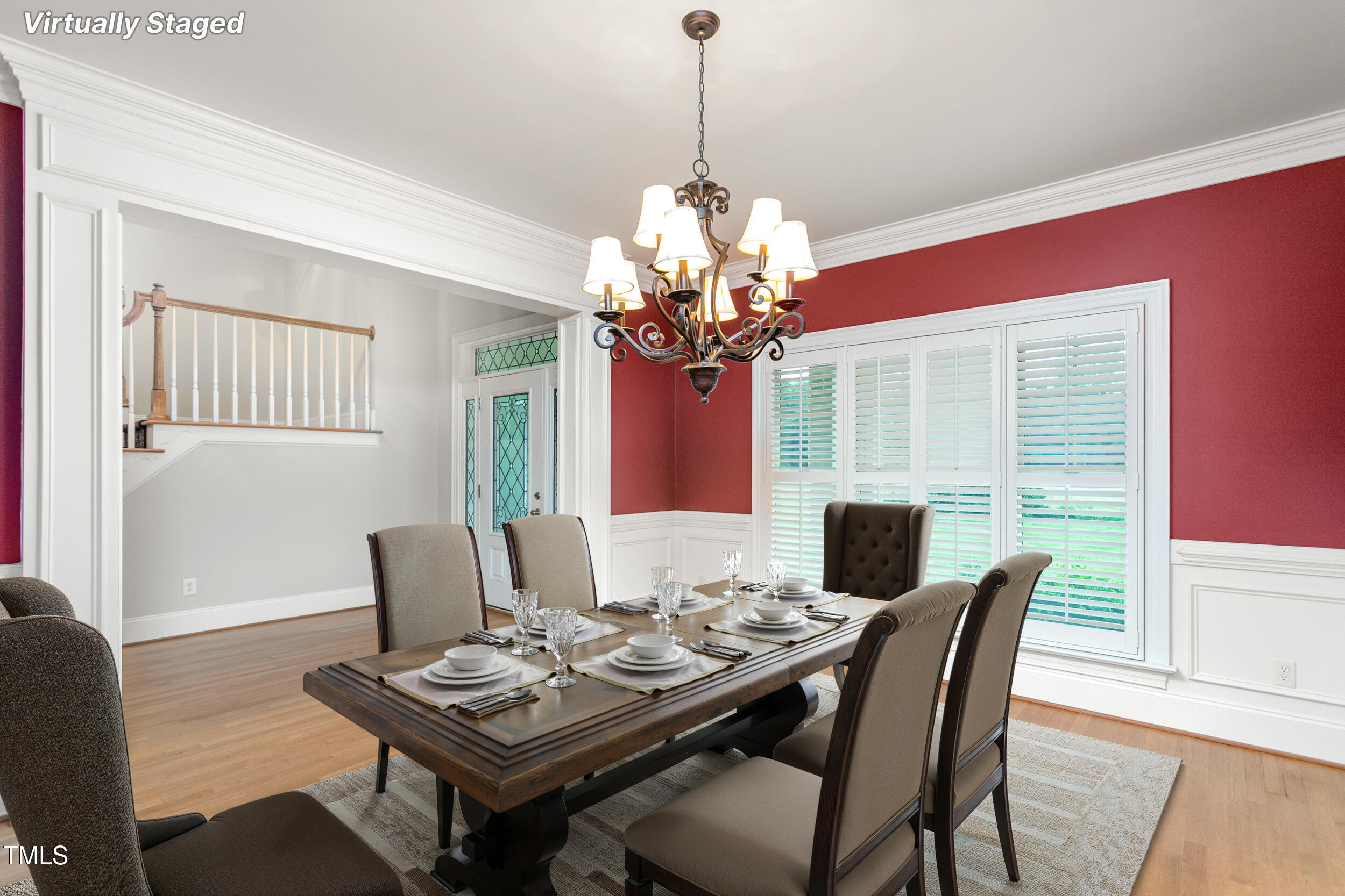 6366 Lineberry Road Liberty, NC 27298 - Photo 9 of 44 a dining room with furniture a chandelier and wooden floor
