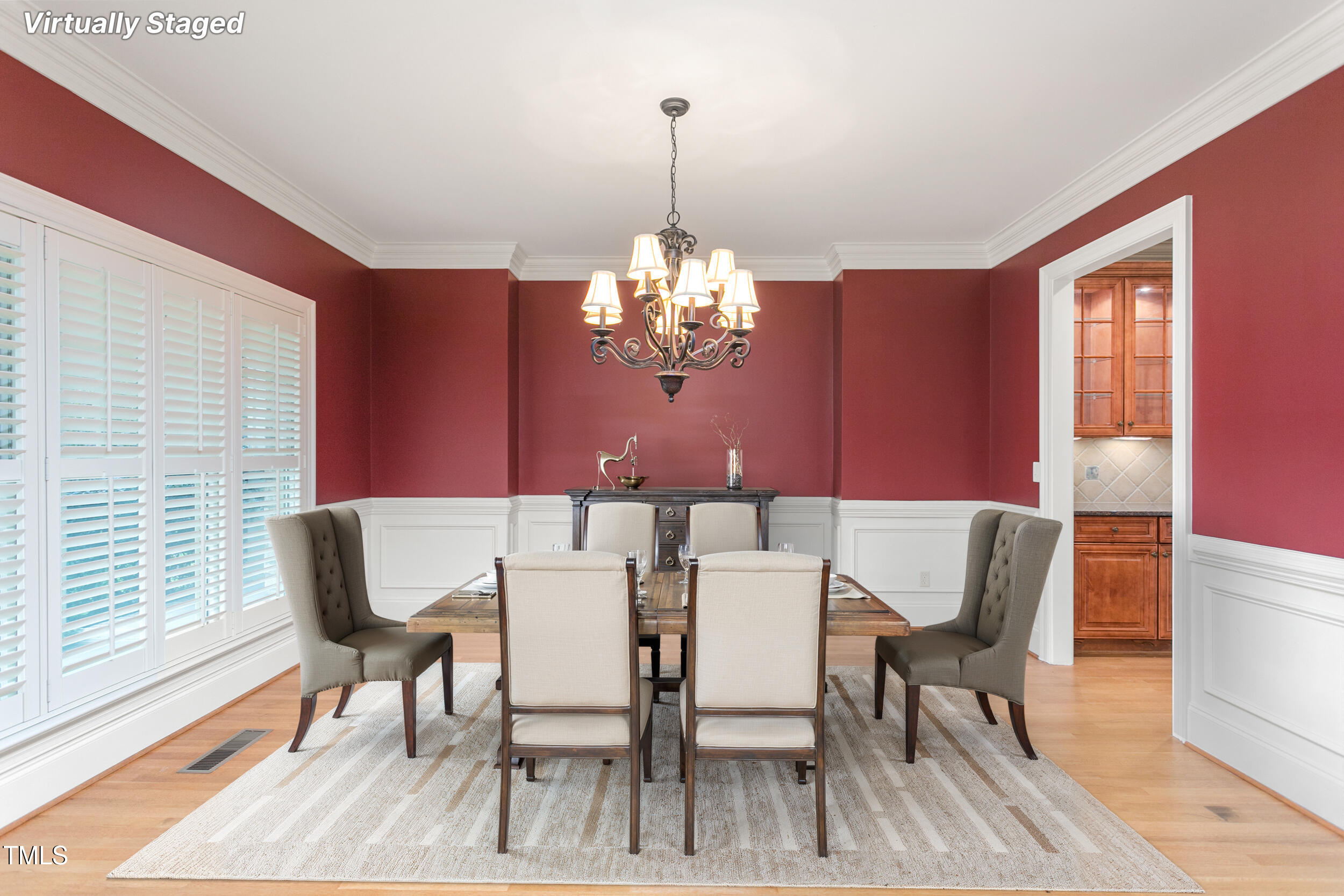 6366 Lineberry Road Liberty, NC 27298 - Photo 10 of 44 a dining room with furniture a chandelier and wooden floor