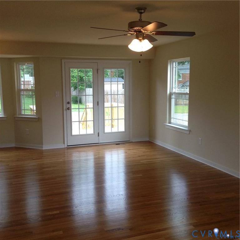 4816 Bethlehem Road Richmond, VA 23230 - Photo 5 of 11 a view of an empty room with wooden floor and a window
