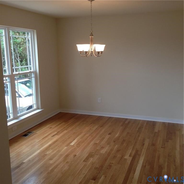 4816 Bethlehem Road Richmond, VA 23230 - Photo 7 of 11 a view of a room with wooden floor and windows