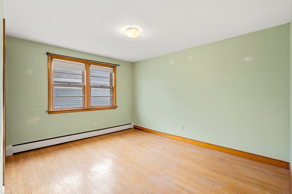 9-13 Sutherland Road Arlington, MA 02476 - Photo 4 of 20 an empty room with a window