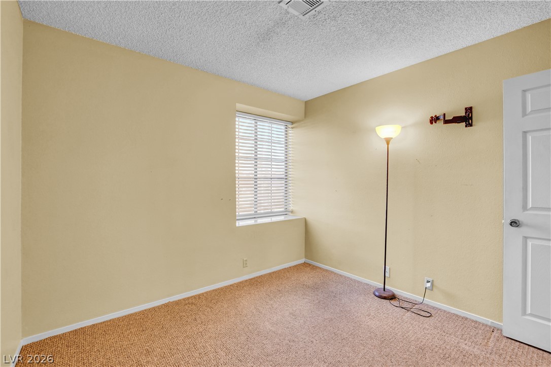 6440 Hartwood Road Las Vegas, NV 89108 - Photo 45 of 59 A window-filled room with plush carpet provides a cozy retreat.
