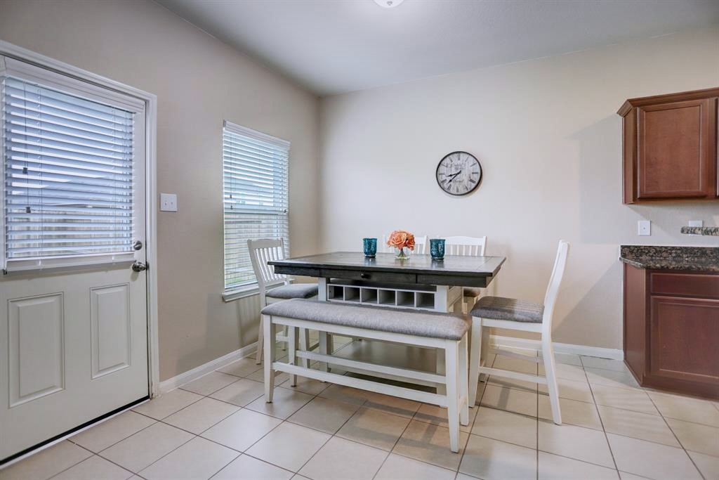 1303 Emerald Stone Drive Rosharon, TX 77583 - Photo 6 of 25 Beautiful open-concept kitchen and breakfast nook designed for effortless entertaining and everyday living.
