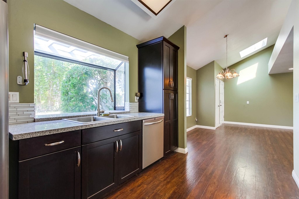875 Viewpoint Drive San Marcos, CA 92078 - Photo 12 of 60 a kitchen with a sink and wooden floor
