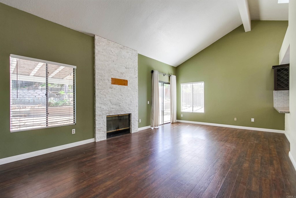 875 Viewpoint Drive San Marcos, CA 92078 - Photo 15 of 60 a view of an empty room with window and wooden floor