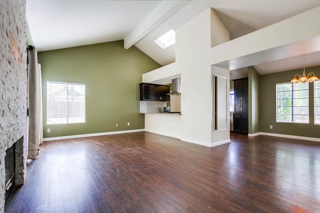 875 Viewpoint Drive San Marcos, CA 92078 - Photo 16 of 60 an empty room with wooden floor and windows
