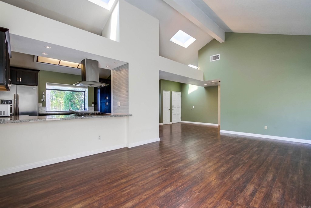 875 Viewpoint Drive San Marcos, CA 92078 - Photo 18 of 60 an empty room with wooden floor and windows