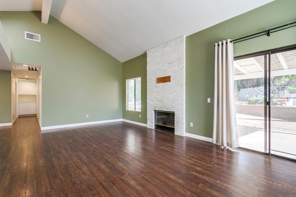 875 Viewpoint Drive San Marcos, CA 92078 - Photo 19 of 60 a view of an empty room with wooden floor and a window