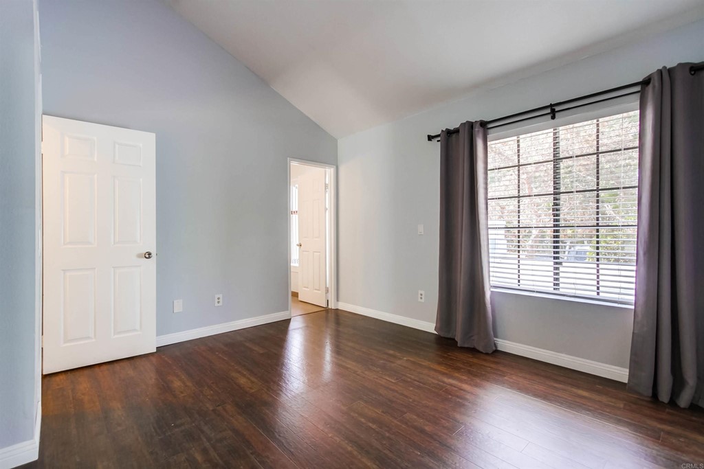 875 Viewpoint Drive San Marcos, CA 92078 - Photo 22 of 60 an empty room with wooden floor and windows