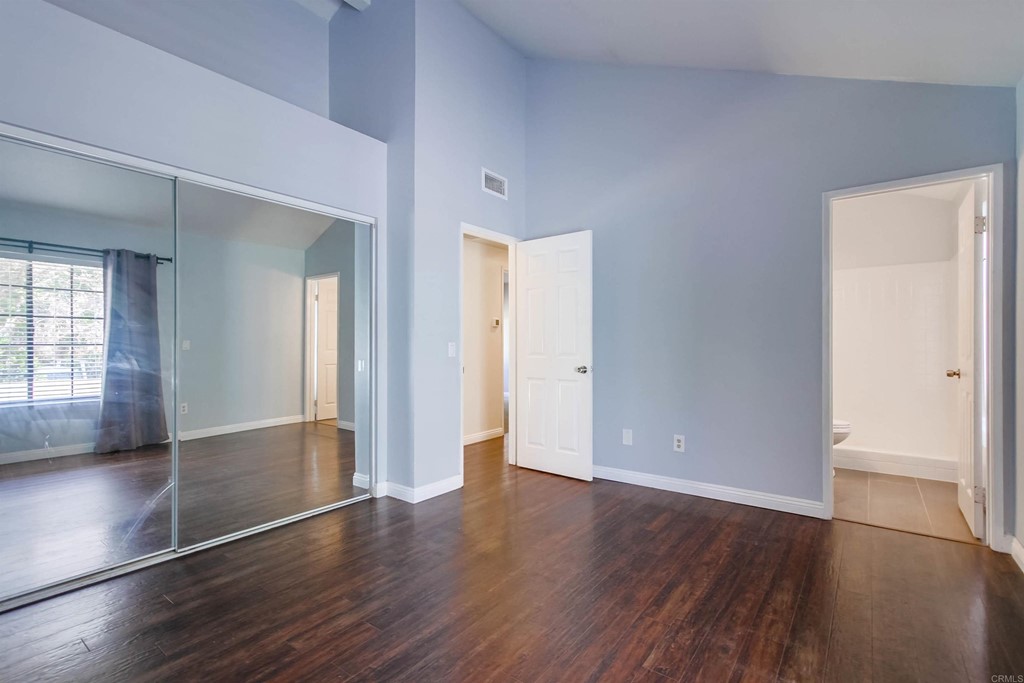 875 Viewpoint Drive San Marcos, CA 92078 - Photo 23 of 60 an empty room with wooden floor & windows