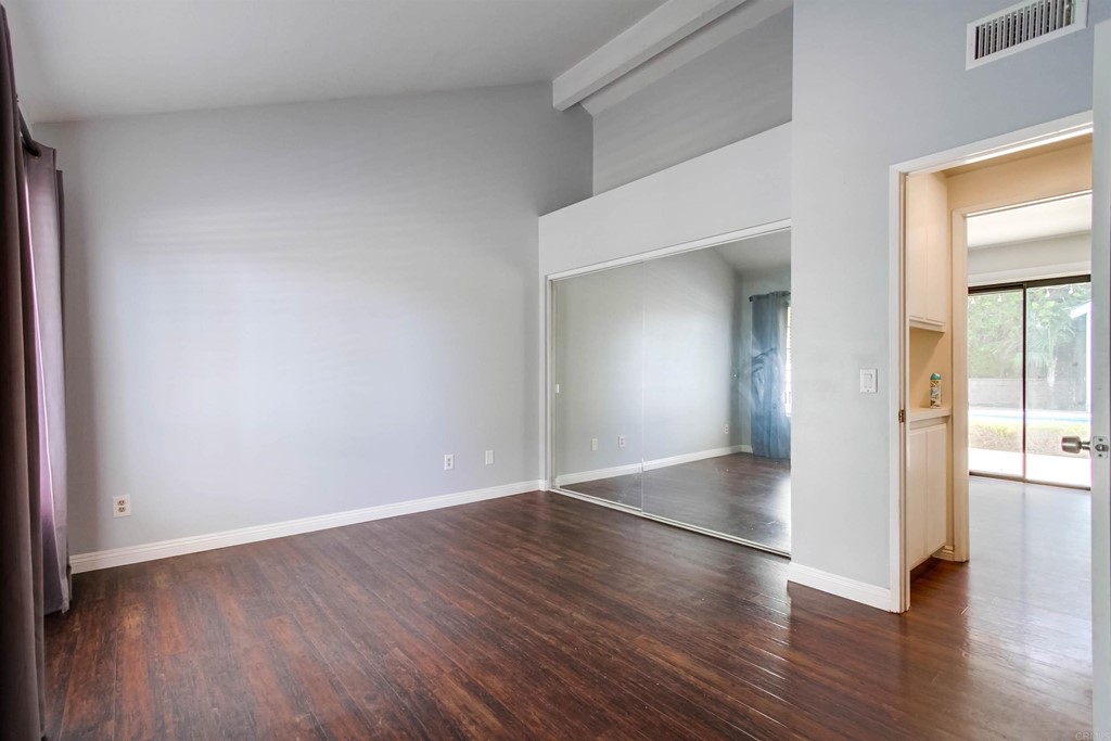 875 Viewpoint Drive San Marcos, CA 92078 - Photo 27 of 60 an empty room with wooden floor and windows