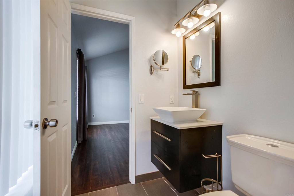 875 Viewpoint Drive San Marcos, CA 92078 - Photo 30 of 60 a bathroom with a sink toilet and mirror
