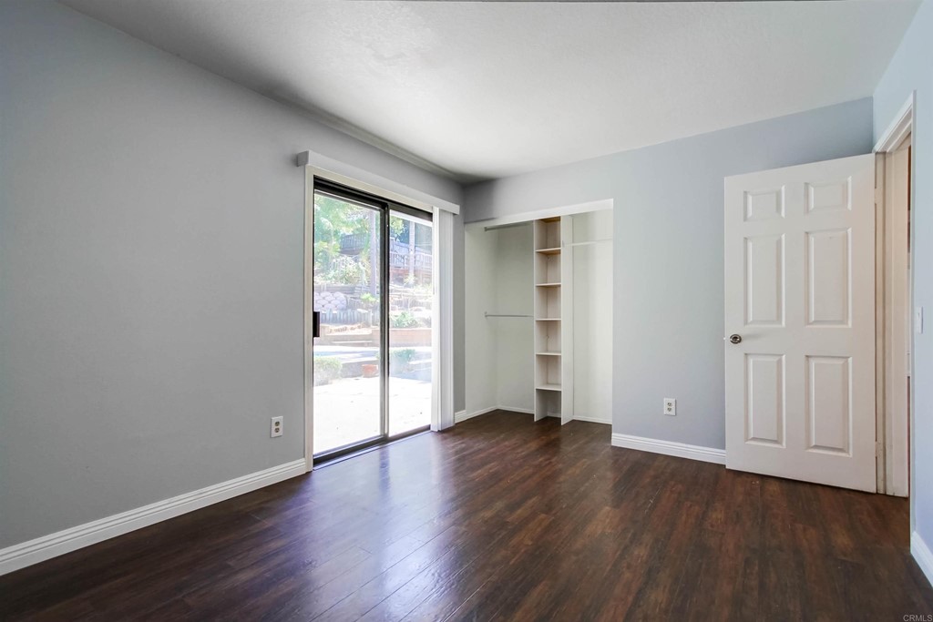875 Viewpoint Drive San Marcos, CA 92078 - Photo 35 of 60 a view of an empty room with wooden floor and a window