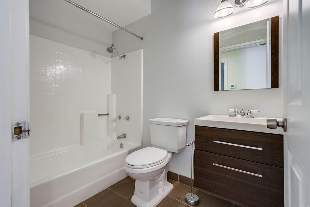 875 Viewpoint Drive San Marcos, CA 92078 - Photo 37 of 60 a bathroom with a sink toilet a vanity and shower