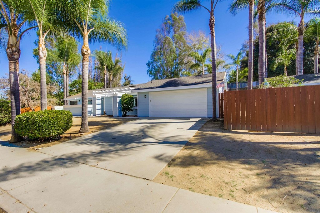 875 Viewpoint Drive San Marcos, CA 92078 - Photo 7 of 60 front view of a house with a yard and potted plants