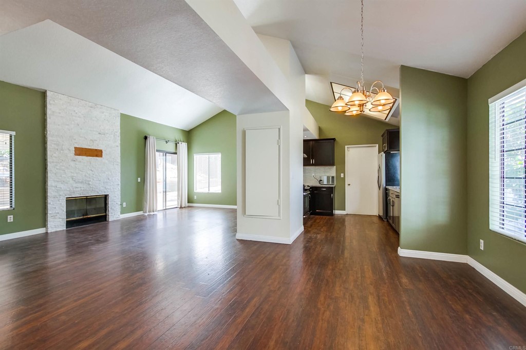 875 Viewpoint Drive San Marcos, CA 92078 - Photo 8 of 60 an empty room with wooden floor and windows