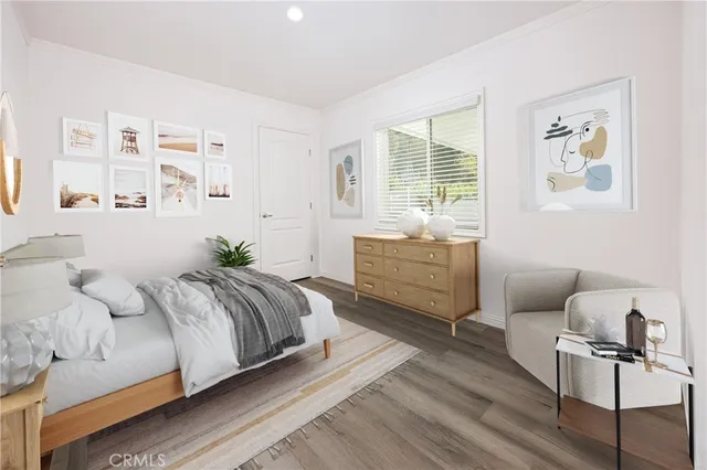 a bedroom with a bed and a couch