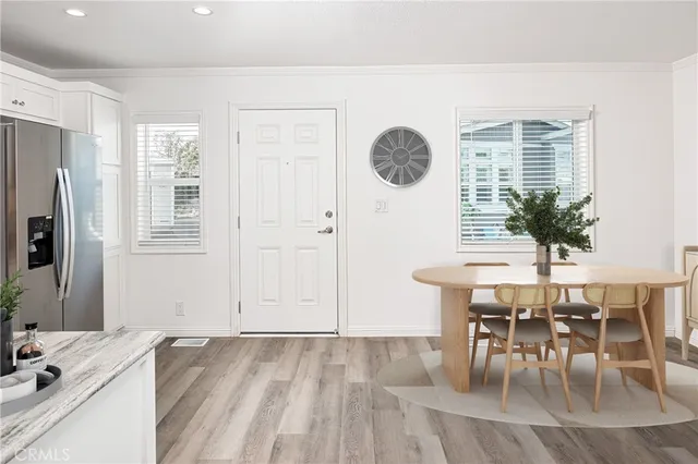 a view of a dining room with furniture and window