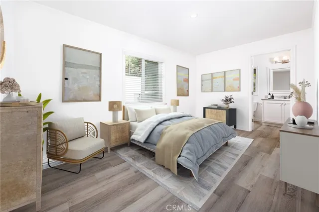 a spacious bedroom with a bed and a couch