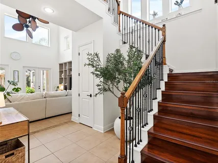 a living room with furniture fireplace and a window