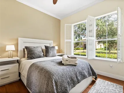 a bedroom with a bed and cabinets