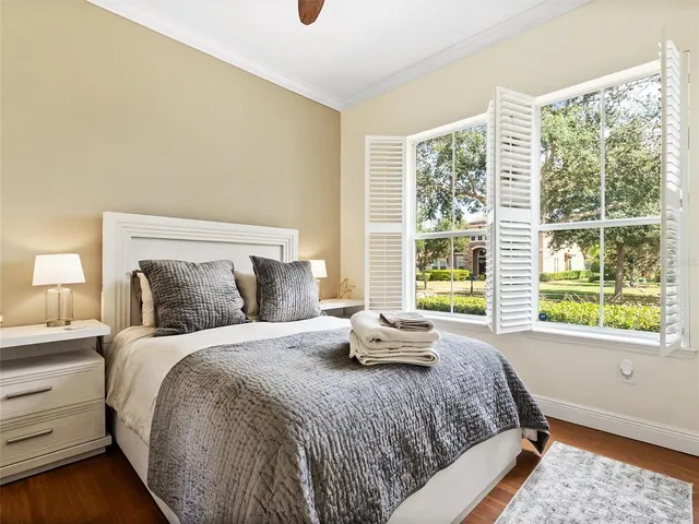 a bedroom with a bed and cabinets