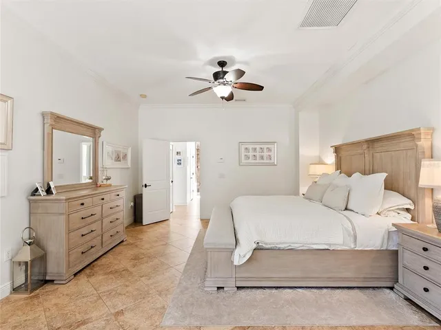 a view of a house with a yard and potted plants