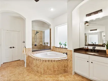 an aerial view of a houses with a swimming pool