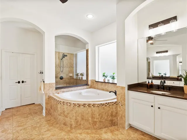 an aerial view of a houses with a swimming pool