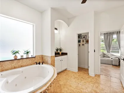 an aerial view of lake residential houses with outdoor space and swimming pool