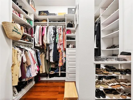 a view of a park with plants and a slide