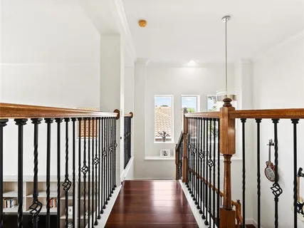 an aerial view of a house with a yard and lake view