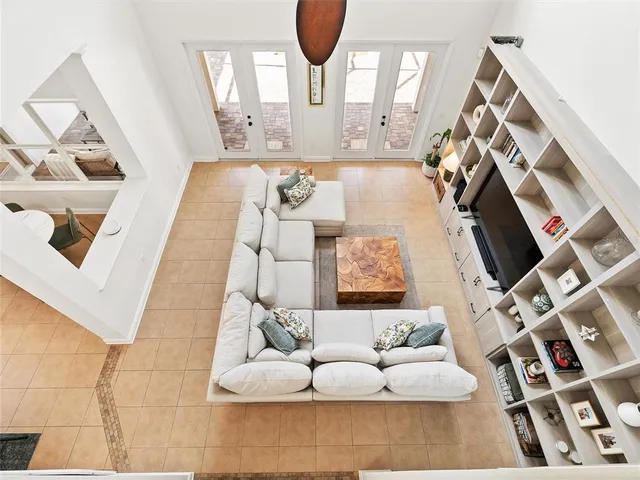 an aerial view of a house with a yard and lake view