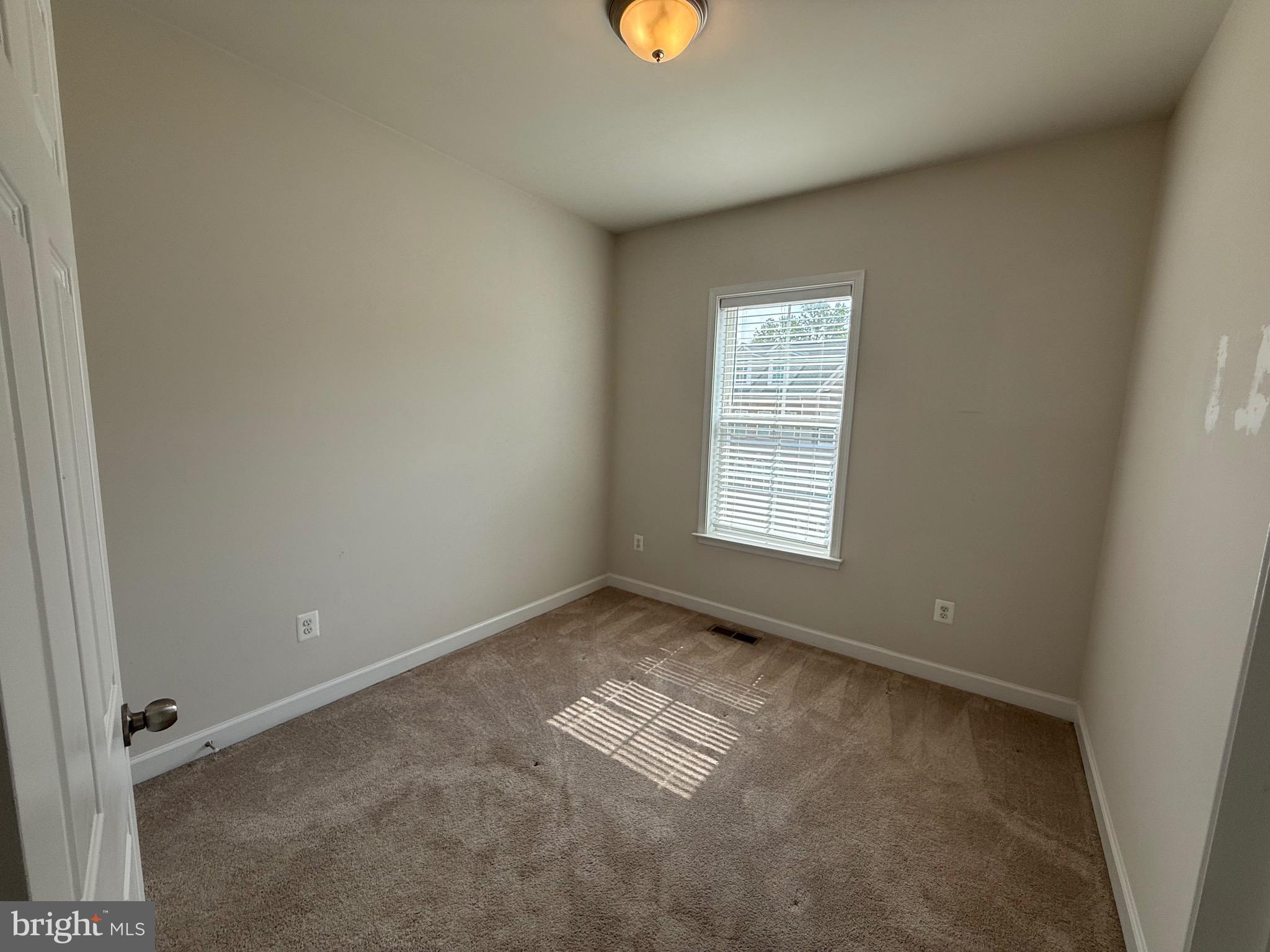 3038 Mia Lane Upper Marlboro, MD 20774 - Photo 6 of 6 an empty room with a window