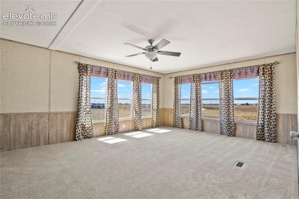 22280 Jones Road Peyton, CO 80831 - Photo 25 of 47 a view of an empty room with a balcony