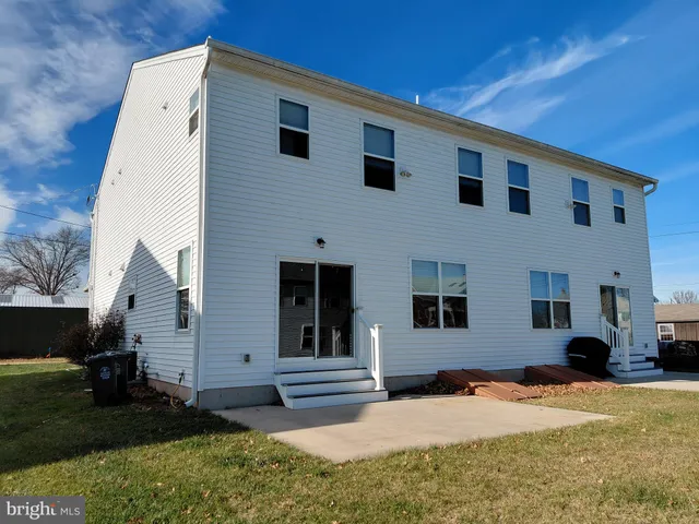 a view of a room with a sink and cabinets