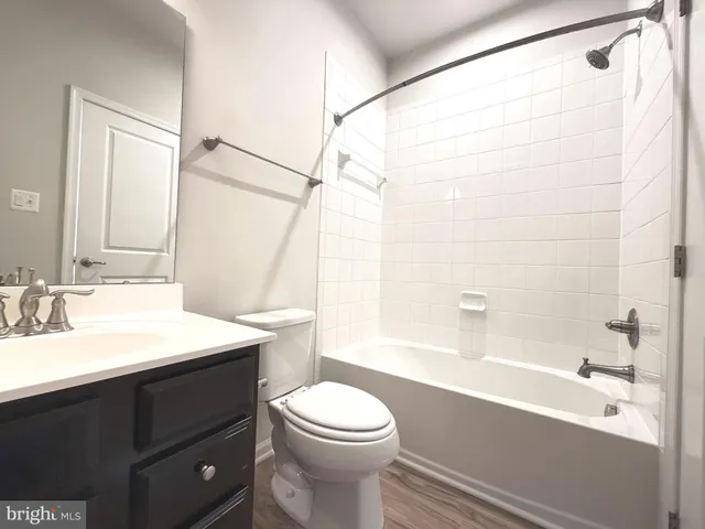 a bathroom with a sink a toilet and a bathtub