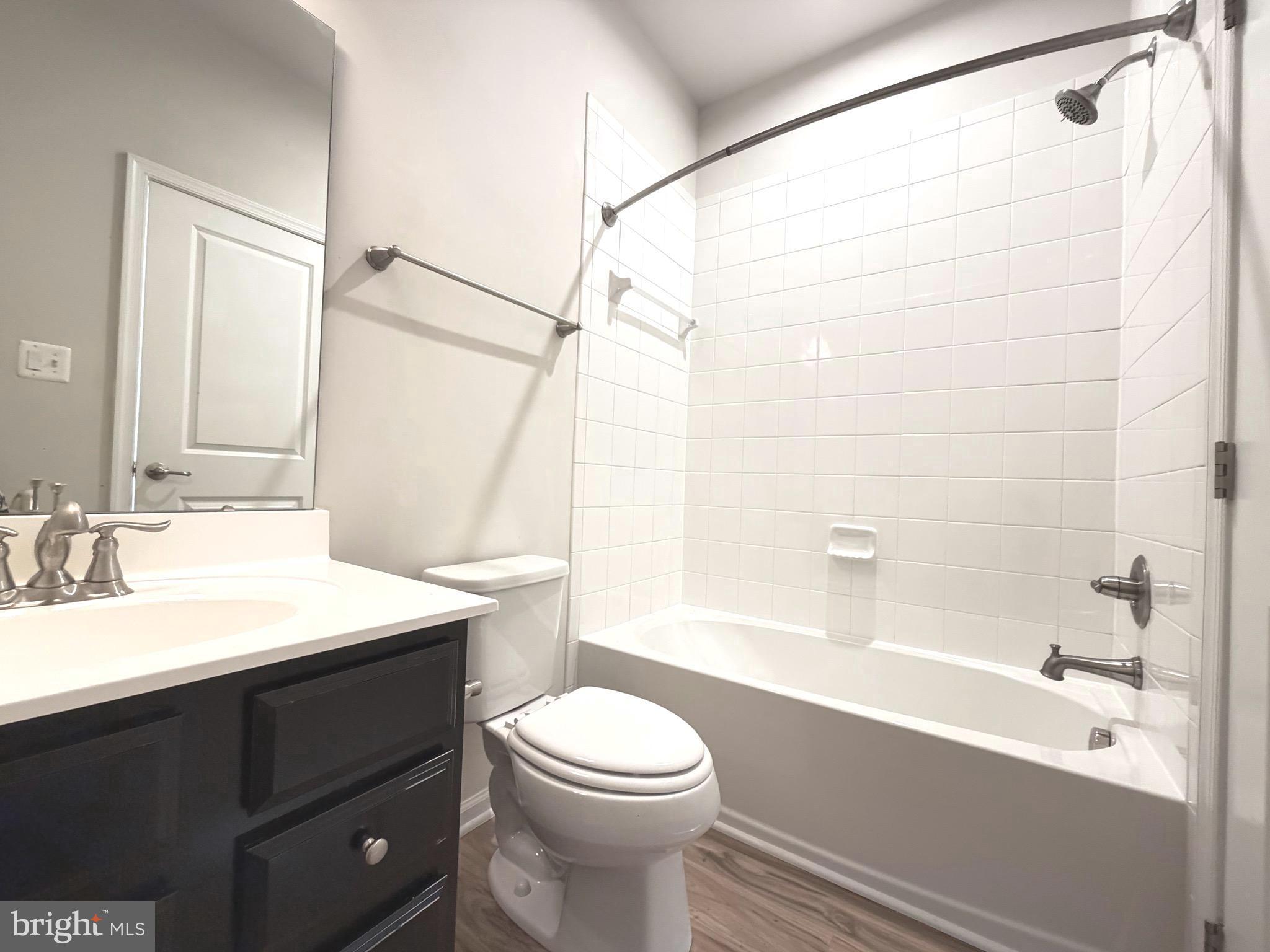 1325 Bruley Road Hanover, MD 21076 - Photo 17 of 22 a bathroom with a sink a toilet and a bathtub