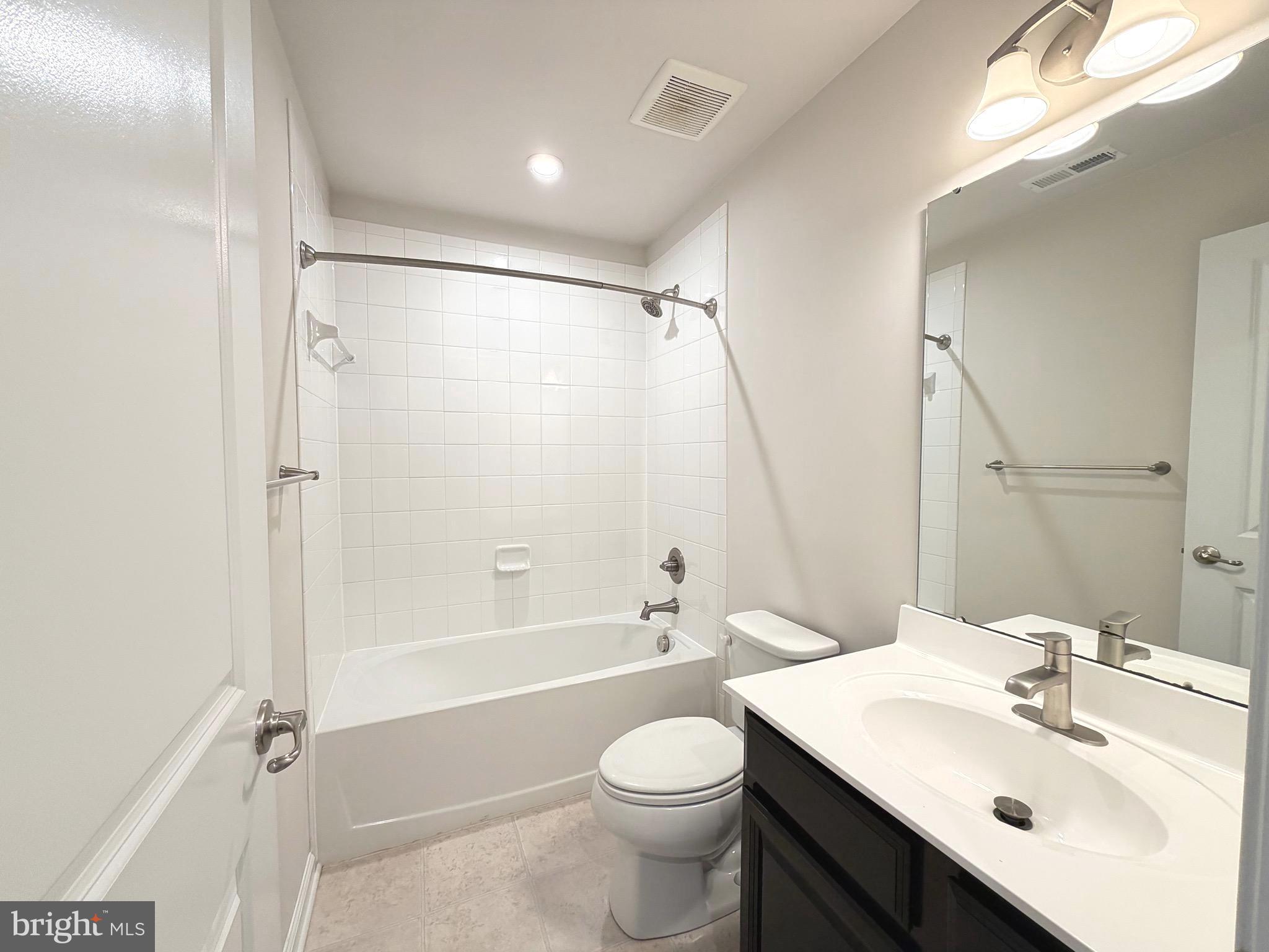 1325 Bruley Road Hanover, MD 21076 - Photo 20 of 22 a bathroom with a sink toilet tub and shower